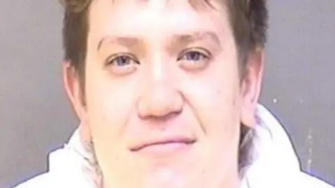 A mugshot of Dayton Webber, 27, who was arrested for murder in Virginia 