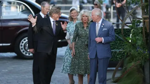 Reuters King Charles, patron of the Royal Horticultural Society, and Queen Camilla are met by Keith Weed, president of the RHS, as they arrive to visit the Chelsea Flower Show