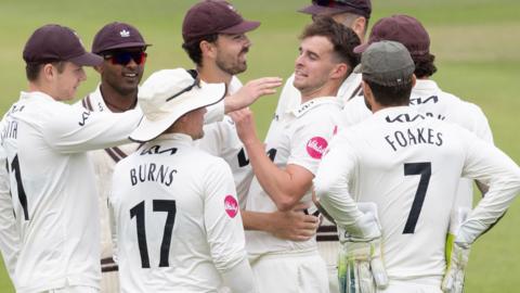 Surrey celebrate taking wicket