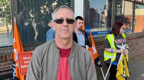 Peter Pritchard standing on a picket line in Hull