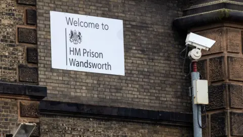 Getty Images A sign on a building reading "welcome to HM Prison Wandsworth", alongside a CCTV camera.