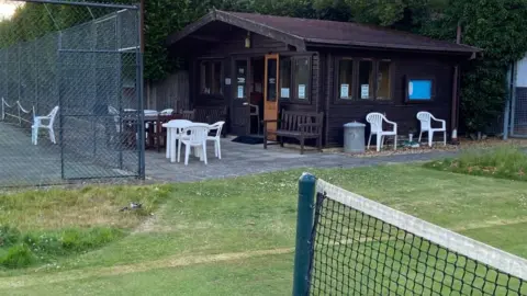 Castor and Ailsworth Tennis Club Hut next to tennis court