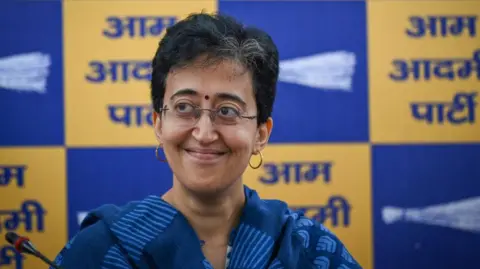 Getty Images NEW DELHI, INDIA - SEPTEMBER 15: AAP leader Atishi addresses a press conference after Arvind Kejriwal announced that he would step down as the Chief Minister at AAP Party Headquarters on September 15, 2024 in New Delhi, India. Kejriwal announced that he would resign as the Chief Minister of Delhi, just two days after being granted bail in the liquor policy case. He had said that a legislative party meeting is expected to be held within the next two days to decide on his replacement. (Photo by Sanchit Khanna/Hindustan Times via Getty Images)