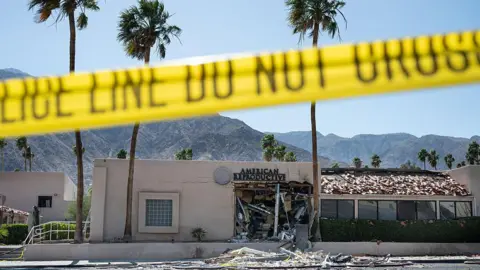 A police line is seen outside a damaged American Reproductive Centers fertility clinic after a bomb blast outside the building in Palm Springs, California, on May 17, 2025.