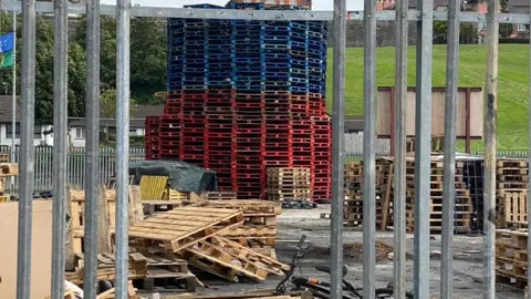 BBC Meenan Square bonfire with pallets stacked