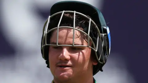 South Africa batter Lhuan-dre Pretorius with his helmet grille lifted above his eyes
