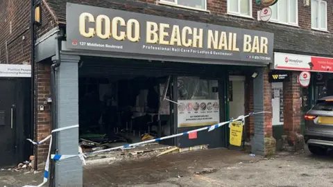 BBC A black fronted nail bar with severe damage to the front