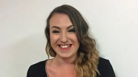 Bethan James wearing a black top and smiling at the camera