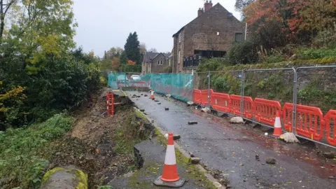 Leon White Outdoor image of a road closure due to a landslip

