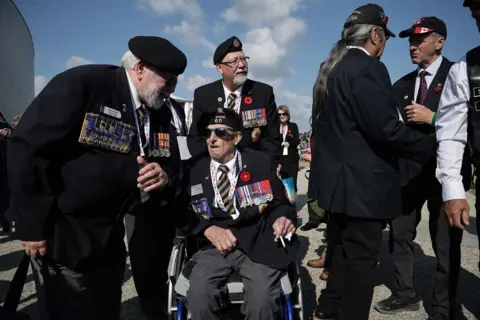 CHRISTOPHE PETIT TESSON/EPA Canadian veteran, Jim Spenst, attends a commemorative ceremony for the 80th anniversary of D-Day landings in Normandy at the Canadian cemetery in Courseulles-sur-Mer, France, 06 June 2024