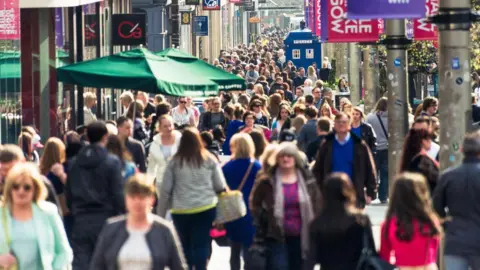 Getty Images A crowded street of people