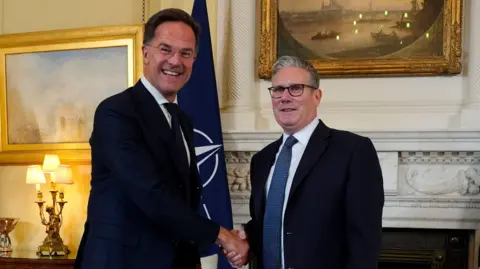 Nato secretary-general Mark Rutte (l) shakes hands with UK Prime Minister Sir Keir Starmer (r) during a meeting at Downing Street on 9 June. 