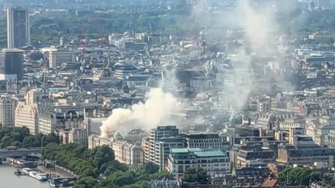 Getty Images: Smoke rises from Somerset House, where a large fire broke out in central London on August 17