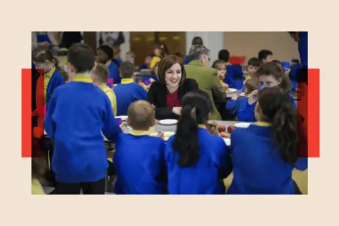 Getty Images Bridget Phillipson talks with children as she attends a school breakfast club