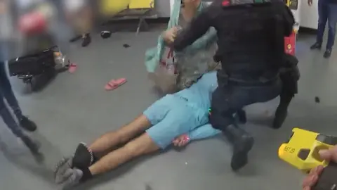 PA Media Video grab image issued by the Crown Prosecution Service (CPS)
from police body worn camera of footage of the alleged assault of three police officers at Manchester Airport which has been played to jurors at Liverpool Crown Court