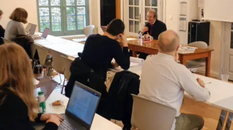 Students listening to a lecturer on the spy course at Sciences Po Saint-Germain university