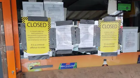 Cambridgeshire Constabulary Closure signs on Constanta Shop