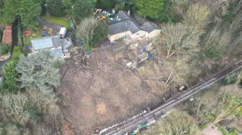 Network Rail An aerial view of the landslip site with two houses which had to be demolished