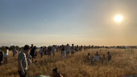 People gathered to watch the solar eclipse