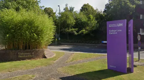 Google A view of the entrance to the University of Hertfordshire. A purple sign outside informs this is the College Lane Campus.