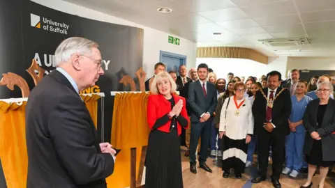 University of Suffolk The Duke of Gloucester looks out toward staff and students of the new hub as Professor Jenny Higham talks.