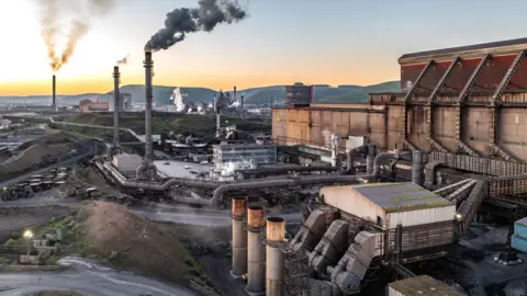 Getty Images Aerial view of steel plant industry in Port Talbot with smoke rising into the sky