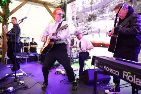 Getty Images Dougie Payne, Fran Healy, Neil Primrose and Andy Dunlop of Travis perform during day one of the TRNSMT 