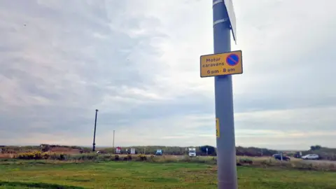 Lancashire County Council Sign showing that motor caravans cannot park between 6pm and 8am