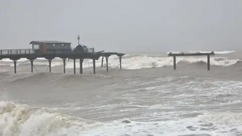 A general view of Teignmouth Grand Pier showing part of the structure destroyed.