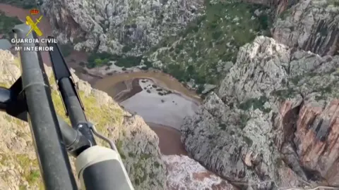 Reuters Helicopter shot of rescue services searching the area