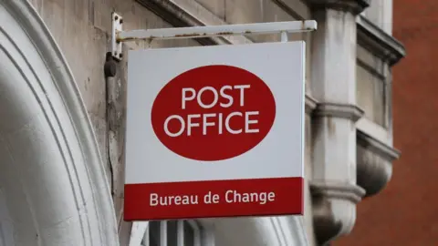 Reuters Close up of a Post Office sign