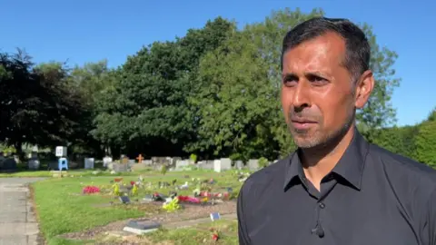 Councillor Afrasiab Anwar in Burnley Cemetery