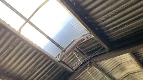 Health and Safety Executive The hole in the roof of a farm outbuilding. The sunlight is pouring through where Jacob fell.