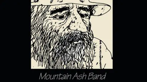 Courtesy of Geoff Bowen A black and white sketch of a scruffy, long-bearded old man, on a black background, with the words 'The Hermit' and 'Mountain Ash Band' showing it's album cover art.