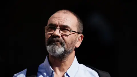 PA Media Andrew Malkinson arrives at the Royal Courts of Justice in London, ahead of his hearing at the Court of Appeal over his 2003 rape conviction. 