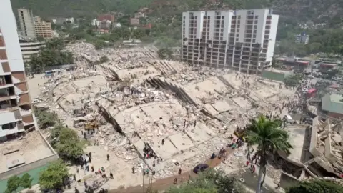 A row of collapsed buildings in La Guaira, Venezuela