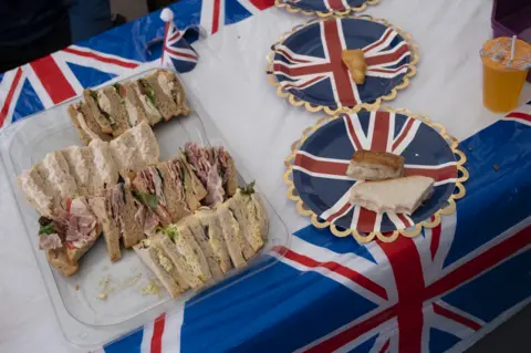 Sandwiches on a table at a street party 