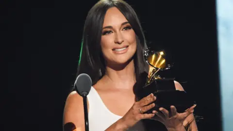 Kacey Musgraves accepts her Grammy Award