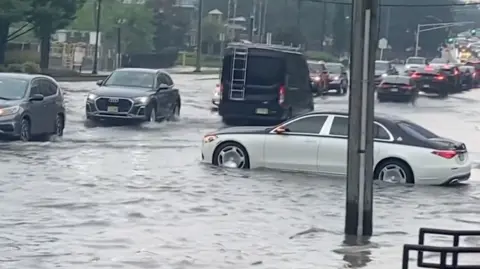 Car partially submerged in water.
