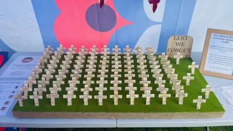 Mark Carter The display of 113 crosses that was created to represent those who died in Godstone village during World War One and World War Two