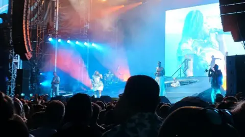 Leanne Fish Basement Jaxx perform to a crowd at Scarborough Open Air Theatre.
