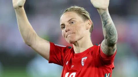 Jess Fishlock waves to the Wales crowd at Euro 2025