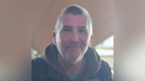 Andrew Upton A man with dark hair looking at the camera