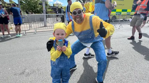 A dad and son dresses as Minions