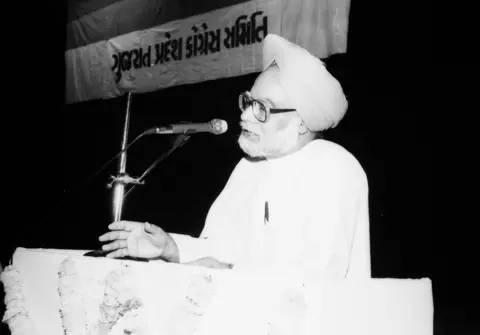 Manmohan Singh speaking at a mic