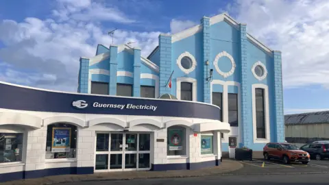 BBC A blue and white Guernsey Electricity building.