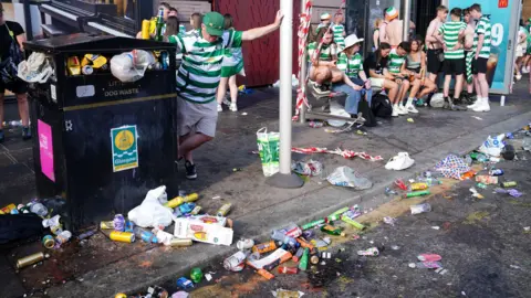 PA Media Bins were overflowing as a result of the celebrations and a considerable amount of rubbish littered the street