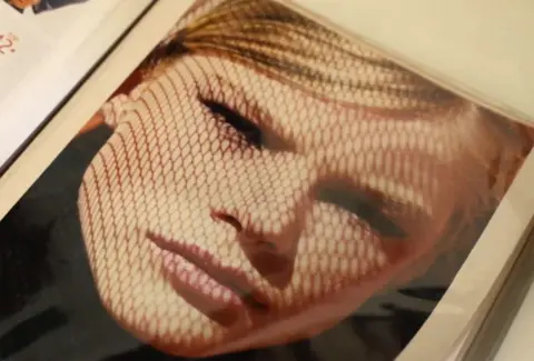 Fekete family archive /BBC / Anselmo Cunha Picture in an album showing an artistic headshot of a young blonde woman looking into the camera.