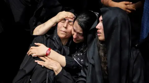 Women react during the funeral of the victims following a reported strike on a school, amid the U.S.-Israeli conflict with Iran, in Minab, Iran, March 3, 2026.