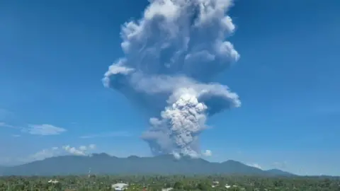 Large column of ash rises above Mount Dukono
